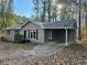 Gray house front with covered carport and small deck at 4212 Anneewakee Rd, Douglasville, GA 30135