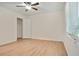 Bright bedroom with light wood floors, ceiling fan, and ample closet space at 2822 Fantasy Ln, Decatur, GA 30033