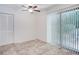 Bedroom with wood-look floors and sliding glass door to patio at 2822 Fantasy Ln, Decatur, GA 30033