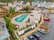 Aerial view of community pool with cabana and surrounding homes at 7008 Senaca Ct, Roswell, GA 30076