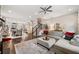 Large living room with hardwood floors and a view into the dining area at 7008 Senaca Ct, Roswell, GA 30076