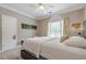 Cozy bedroom with carpeted flooring and natural light from a large window at 1510 Great Oaks Dr, Lawrenceville, GA 30045