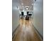 Hallway leading to a dining area and kitchen with hardwood floors at 1380 Forest Se Ln, Marietta, GA 30067