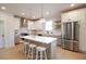 Modern kitchen with stainless steel appliances, white cabinets, and large island at 2455 Claude Nw St, Atlanta, GA 30318