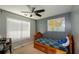 bedroom with a twin bed, ceiling fan and blinds on the window at 675 Station View Run, Lawrenceville, GA 30043