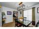 Bright dining room with glass top table and four chairs at 675 Station View Run, Lawrenceville, GA 30043