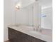 Modern bathroom with double vanity and quartz countertop at 966 Moda Dr, Atlanta, GA 30316