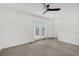 Bright bedroom with carpet, ceiling fan, and access to a private deck at 966 Moda Dr, Atlanta, GA 30316