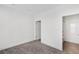 Simple bedroom with grey carpet and en-suite bathroom at 966 Moda Dr, Atlanta, GA 30316