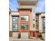 Modern three-story townhome with red front door at 966 Moda Dr, Atlanta, GA 30316