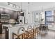 Modern kitchen with stainless steel appliances and breakfast bar at 966 Moda Dr, Atlanta, GA 30316