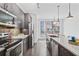 Modern kitchen with stainless steel appliances and island at 966 Moda Dr, Atlanta, GA 30316
