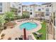 Community pool with surrounding lounge chairs at 966 Moda Dr, Atlanta, GA 30316