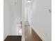 Modern staircase with dark wood steps and a bright white wall at 966 Moda Dr, Atlanta, GA 30316