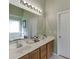 Spacious bathroom featuring double vanity, large mirror, and ample counter space at 1107 Whatley Mill Ln, Lawrenceville, GA 30045