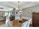 Farmhouse dining table in bright dining room, open to living room at 1107 Whatley Mill Ln, Lawrenceville, GA 30045