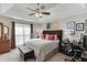 Large main bedroom with a king-size bed and a built-in workspace at 1107 Whatley Mill Ln, Lawrenceville, GA 30045