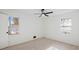 Bright bedroom with wood-look floors, ceiling fan, and two windows at 2686 Abilene Trl, Snellville, GA 30078