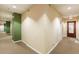 Clean and bright apartment building hallway with green accent wall at 32 Peachtree Nw St # 1106, Atlanta, GA 30303