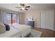 Relaxing Primary bedroom with a ceiling fan, ample closet space, and balcony access at 43 Basswood Cir, Atlanta, GA 30328