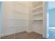 Walk-in closet with wire shelving and wood flooring at 9671 Squirrel Wood Run, Douglasville, GA 30135