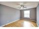 Simple bedroom with wood floors and ceiling fan at 2371 Shadow Pines Ct, Duluth, GA 30096