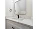 Stylish bathroom featuring a quartz countertop and black fixtures at 352 E Post Oak Sw Xing, Marietta, GA 30008