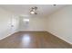 Bright bedroom featuring hardwood floors and ceiling fan at 175 Jayne Ellen Way, Alpharetta, GA 30009