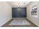 Bright dining room features dark-blue accent wall and hardwood floors at 175 Jayne Ellen Way, Alpharetta, GA 30009