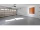 Attached garage with painted floor and overhead door at 175 Jayne Ellen Way, Alpharetta, GA 30009