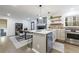 Modern kitchen with island, white cabinets, and stainless steel appliances at 175 Jayne Ellen Way, Alpharetta, GA 30009