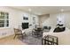 Inviting living room with white painted brick fireplace, plush sofa, and view of staircase at 605 Patrick Ne Pl, Sandy Springs, GA 30328