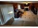 Gathering room with tile floors and fireplace at 7472 Wood Ct, Lithonia, GA 30058