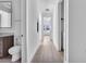 Bright hallway with light wood flooring and access to bedrooms and laundry at 775 Juniper Ne St # 619, Atlanta, GA 30308