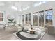 Bright living room with high ceilings, large windows, and hardwood floors at 775 Juniper Ne St # 619, Atlanta, GA 30308