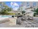 Resort-style pool with grilling station and comfortable seating for residents at 775 Juniper Ne St # 619, Atlanta, GA 30308