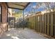 Private backyard with covered patio and wooden fence at 6851 Roswell Rd # D14, Atlanta, GA 30328