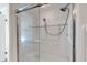Accessible walk-in shower with grab bars and sliding glass doors at 6851 Roswell Rd # D14, Atlanta, GA 30328