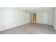 Spacious bedroom with neutral walls, ceiling fan, and carpeted flooring at 6851 Roswell Rd # D14, Atlanta, GA 30328