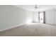Spacious bedroom with neutral walls, a ceiling fan, and carpeted flooring at 6851 Roswell Rd # D14, Atlanta, GA 30328