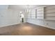Dining room with built-in shelving, chandelier, and wood-look floors at 6851 Roswell Rd # D14, Atlanta, GA 30328