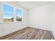 Bedroom with wood-style flooring, white walls, and two large windows at 1561 Layton Lane Nw Dr # 21, Atlanta, GA 30318