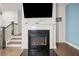 Modern electric fireplace with a black granite hearth at 160 Auburn Gate Ln, Auburn, GA 30011