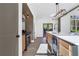 Modern kitchen with island, stainless steel appliances, and white quartz countertops at 4840 Moon Rd, Powder Springs, GA 30127