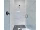 Walk-in shower with pebble stone floor and glass enclosure at 4840 Moon Rd, Powder Springs, GA 30127