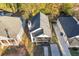 Backyard aerial view featuring a black roof, back porch and concrete driveway at 736 Windsor Sw St, Atlanta, GA 30310