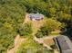 Aerial view showing house and surrounding land with trees and driveway at 776 Old Lathemtown Road, Canton, GA 30115