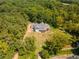 Aerial view of house nestled in woods, showcasing expansive property at 776 Old Lathemtown Road, Canton, GA 30115