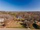 Aerial view of property showing house, outbuildings, and surrounding landscape at 776 Old Lathemtown Road, Canton, GA 30115