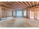 Unfinished basement with framed walls and large windows at 776 Old Lathemtown Road, Canton, GA 30115
